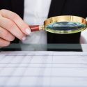 Businesswoman Holding Magnifying Glass Businesswoman Looking At Document Through Magnifying Glass